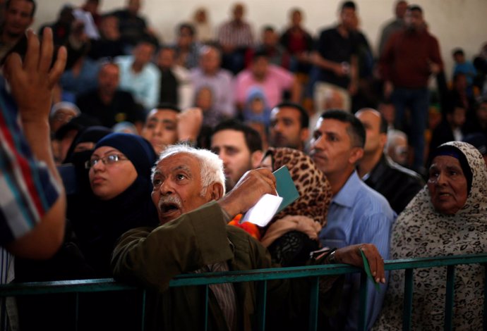 Man asks for a travel permit to cross into Egypt through the Rafah border crossi