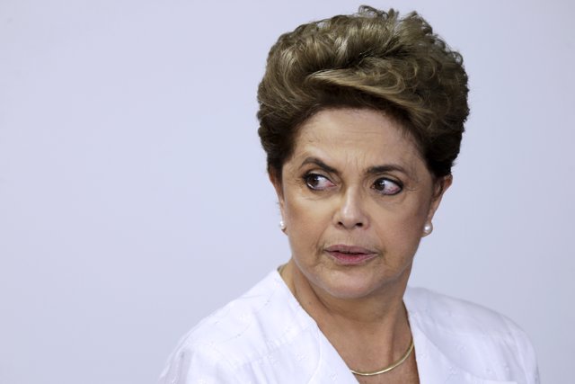 Brazil's President Rousseff looks on during signing of federal land transfer agr