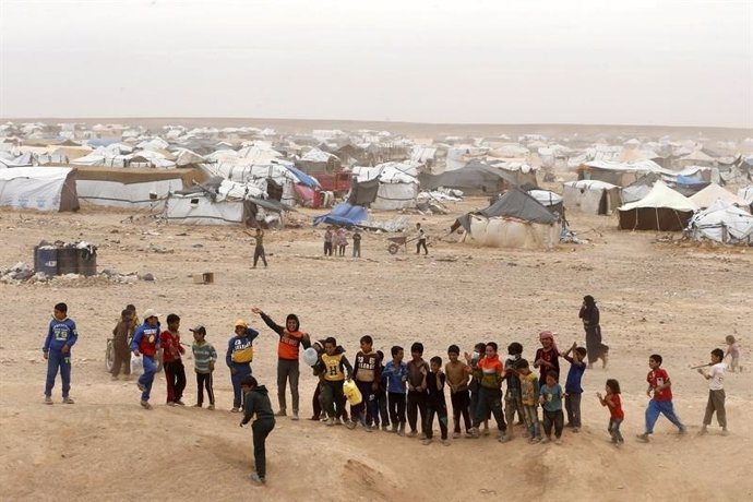 Sirios en un campo de refugiados