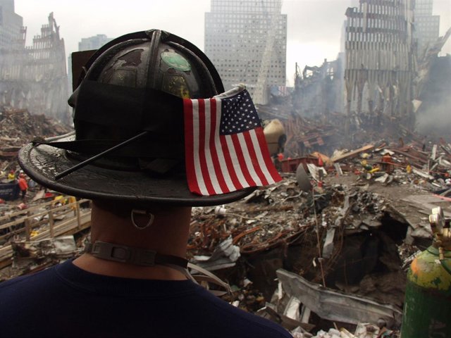 New York, NY, September 25, 2001 -- A firefighter surveys the remaining shell