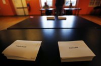 Juppé y Sarkozy depositan su voto en las primarias del centro-derecha