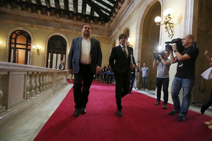 El líder de ERC, O.Junqueras, y el presidente de la Generalitat, C.Puigdemont
