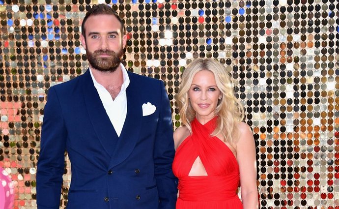   Joshua Sasse And Kylie Minogue Attend The "Absolutel