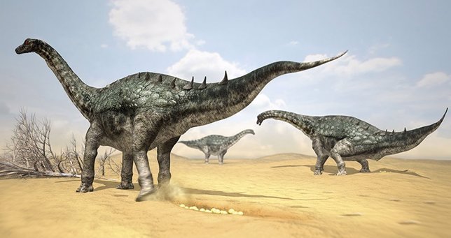 Escena que recrea un grupo de titanosaurias en el momento de la puesta.