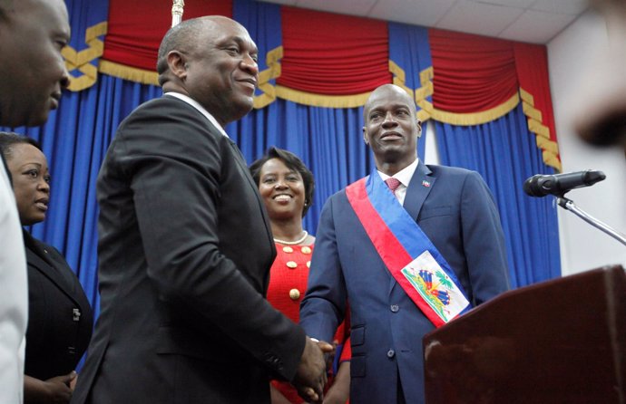 Haitian President Jovenel Moise shakes hands with the President of the Haitian P