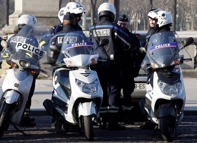 French police are seen with their scooters as they patrol near the Eiffel Tower 