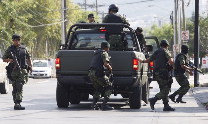 Soldiers take part in a military operation to capture drug kingpin Hector Huerta