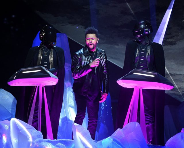 LOS ANGELES - FEBRUARY 12: The Weeknd (C) and Daft Punk perform onstage at the 5