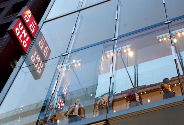 Japan's Fast Retailing Co Ltd's Uniqlo signboard is pictured at its shop in Toky