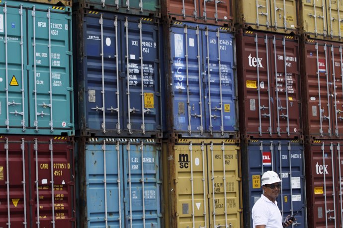 A Panama Ports Company employee is seen next to containers at the Balboa port in