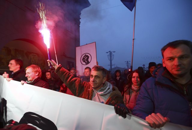 People march during a protest against new taxes and increased tariffs for commun