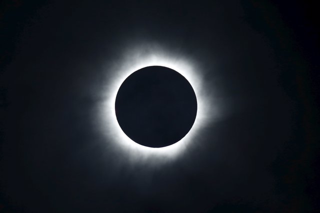 A total solar eclipse is seen from the beach of Ternate island, Indonesia, March