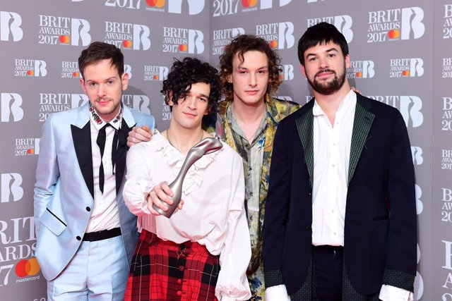 The 1975's Adam Hann (L - R), George Daniel, Ross MacDonald and Matthew Healy wi