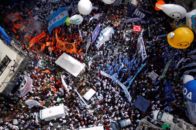 Members of Argentina's National General Confederation of Labor (CGT) stage a bro