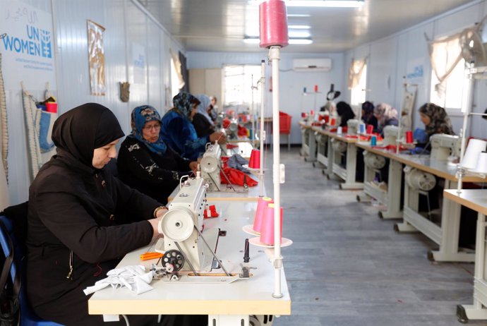 Syrian women working in a sewing workshop in the U.N. Women center at Al Zaatari