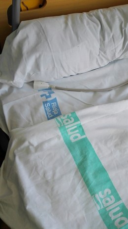 Imagen de una cama con las sábanas