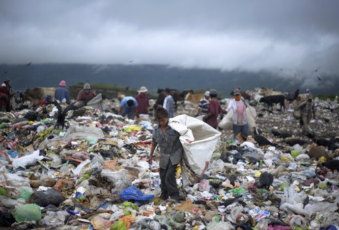 A young boy collects waste at a landfill on the outskirts of Tegucigalpa Septemb