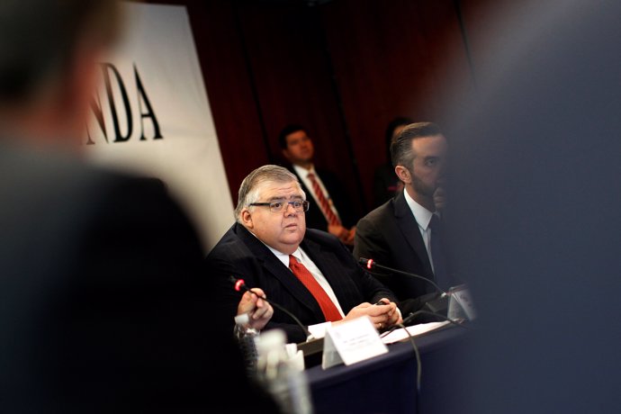 Mexican Central Bank Governor Agustin Carstens listens during a meeting at the S