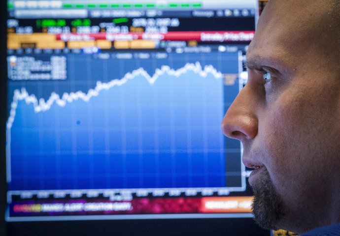 A trader looks at his screens on the floor of the New York Stock Exchange March 