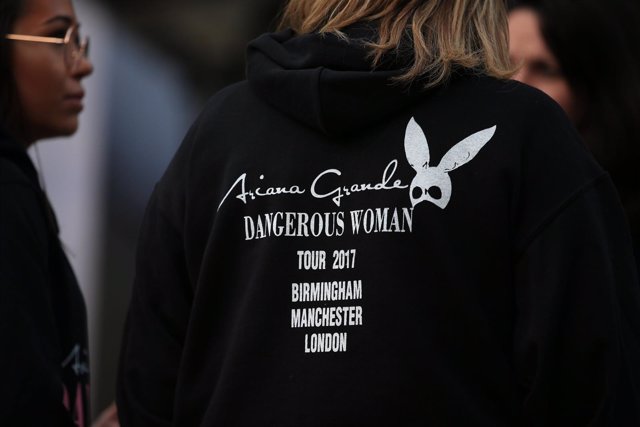 A fan wears an Ariana Grande hoodie near the Manchester Arena where a suspected 