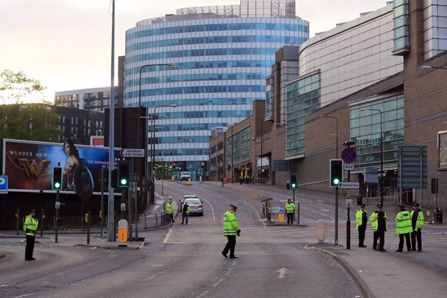 Police patrol outside the Manchester Arena the morning after a suspected terrori