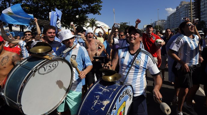 Fans of Argentina beat drums and cheer at Copacabana beach ahead of their 2014 W