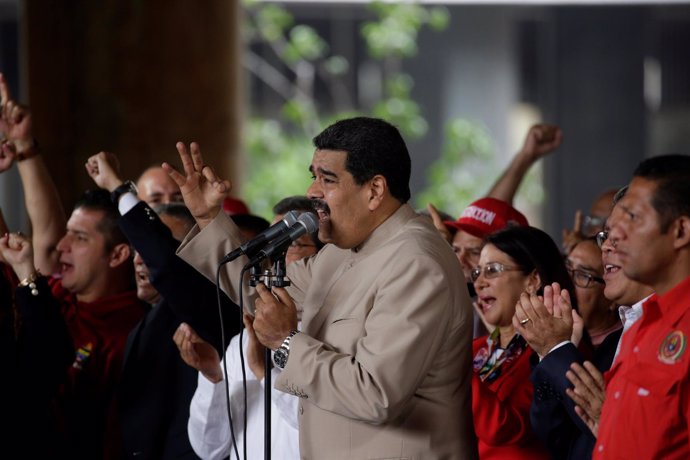 Venezuela's President Nicolas Maduro (C) speaks during a gathering outside the N
