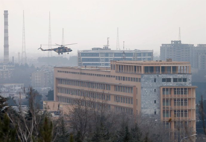 Smoke rises from a military hospital at the site of blast and gunfire in Kabul, 