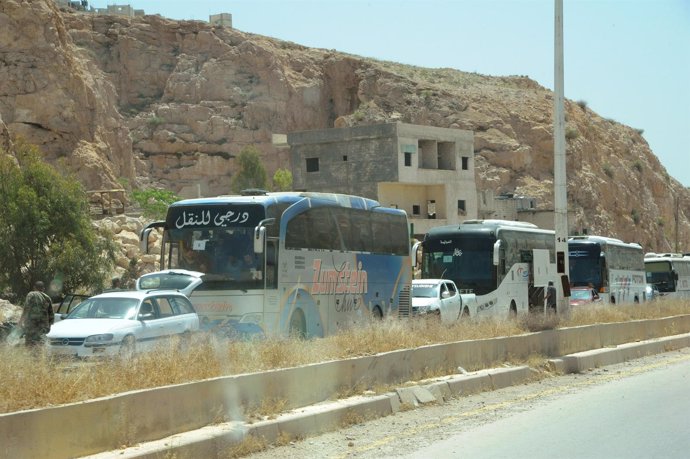 Evacuación de milicianos rebeldes de Barzeh, en Damasco