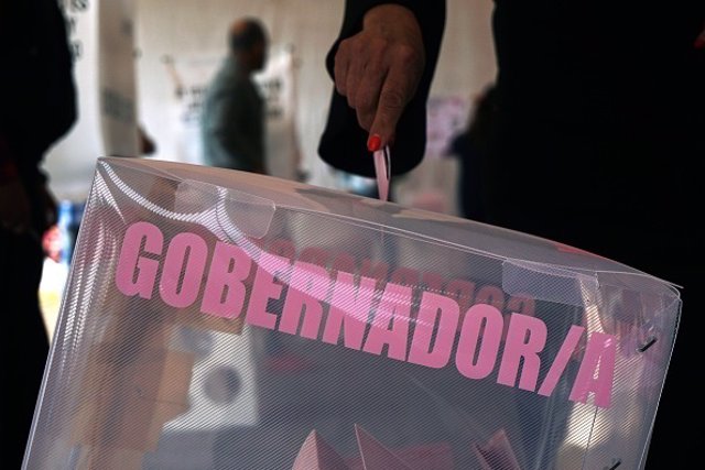 A voter casts a ballot during the gubernatorial election in Metepec, Mexico Stat