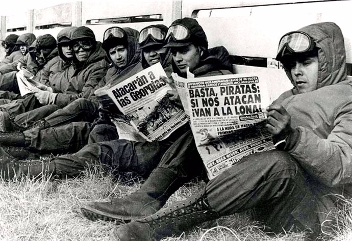 Argentinian army soldiers read newspapers in Port Stanley, during the Falkland W
