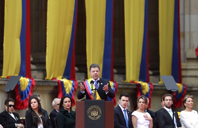 Colombia's President Juan Manuel Santos speaks after being decorated with the Co