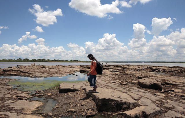 Rocks are seen exposed on the edge of the Paraguay River as the unusually low le