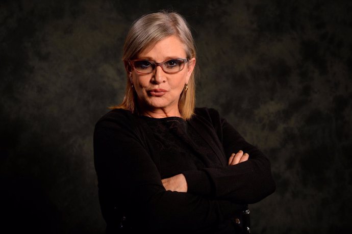 Dec 2, 2015; New York, NY, USA; Carrie Fisher poses for a photo while promoting 