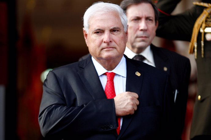 FILE PHOTO - Panama's President Ricardo Martinelli listens to the national anthe