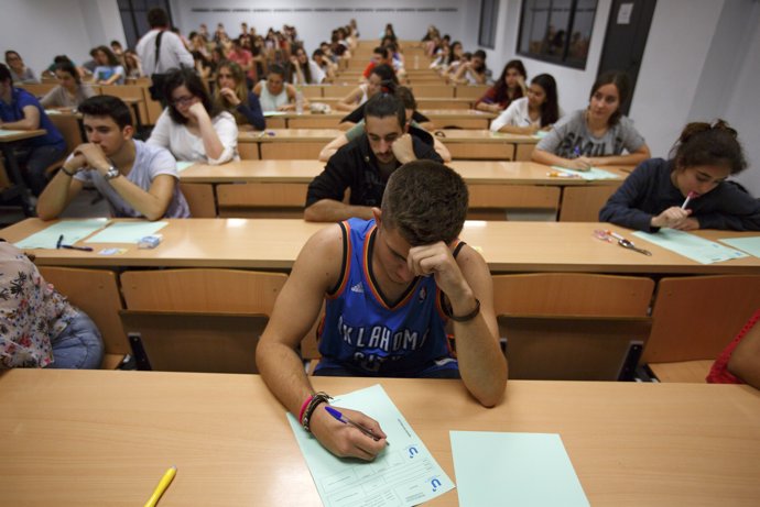 Students take a university entrance examination at a lecture hall in the Andalus
