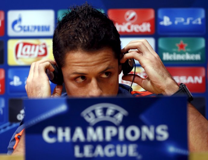 Bayer Leverkusen's Javier "Chicharito" Hernandez adjusts his earphones during a 