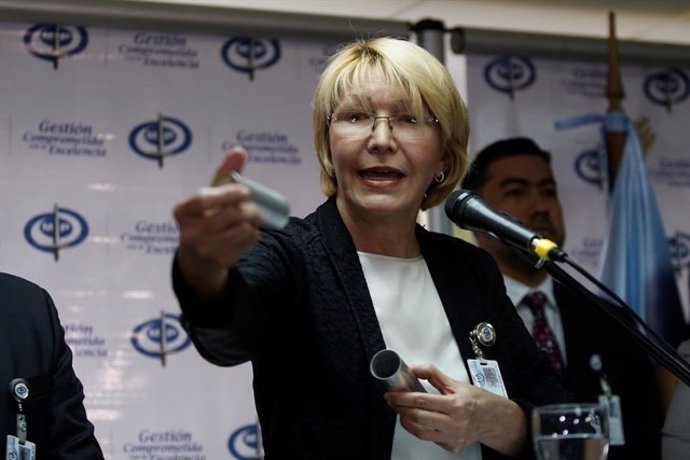 Venezuela's chief prosecutor Luisa Ortega Diaz displays a tear gas canister as s