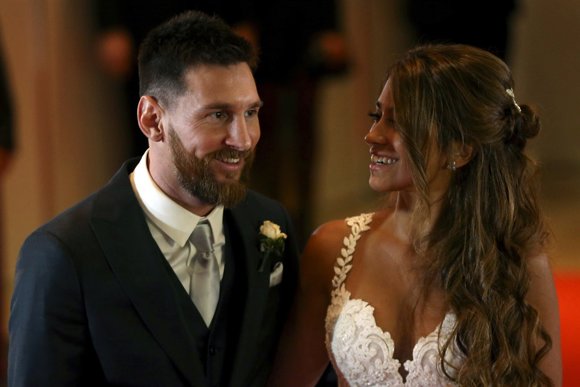 Argentine soccer player Lionel Messi and his wife Antonela Roccuzzo pose at thei