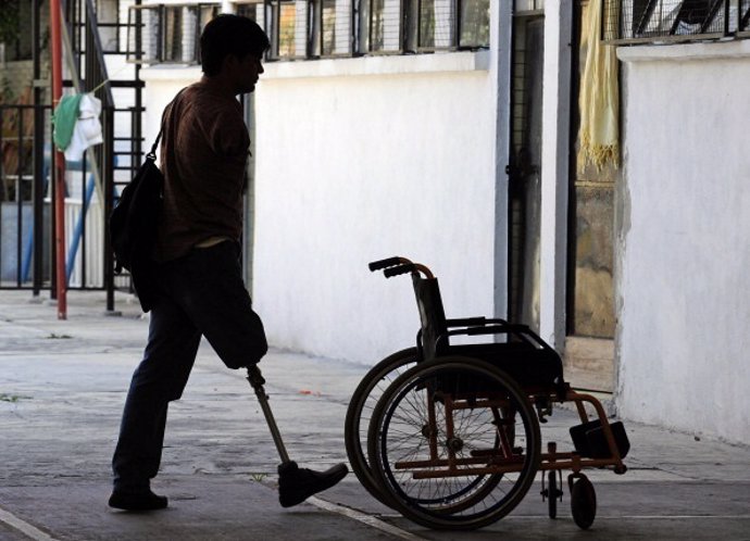 A handicapped Honduran immigrant stands in the Nazaret shelter in Mexico City on
