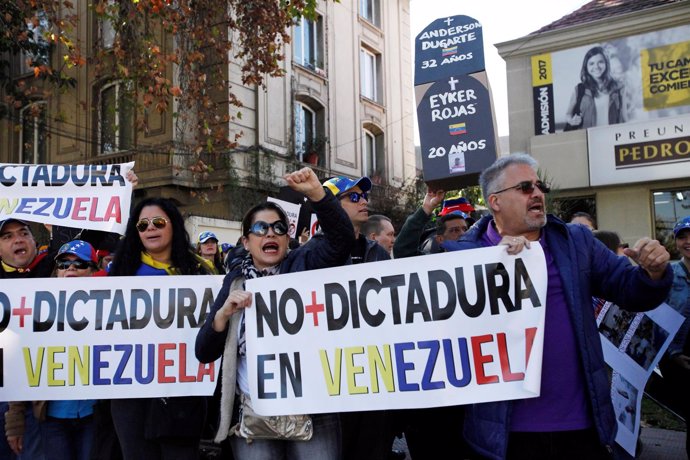 Opposition supporters are seen during a rally against Venezuela's President Nico