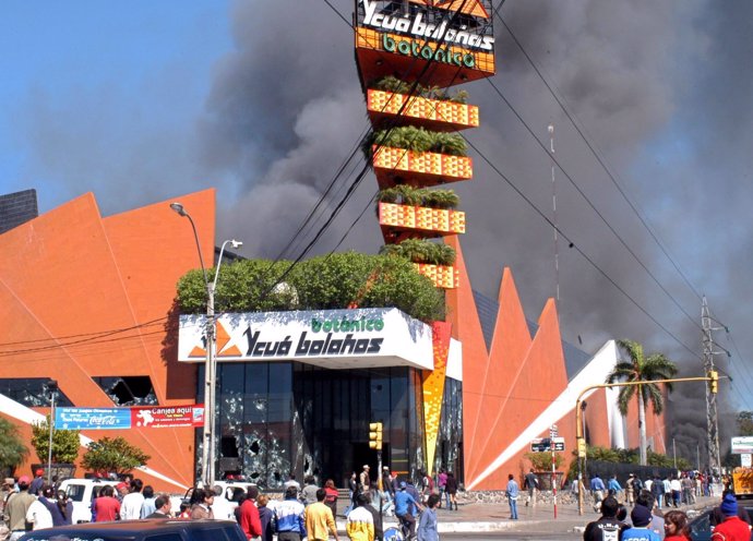 Smoke rises from a supermarket on the outskirts of Paraguay's capital Asuncion, 