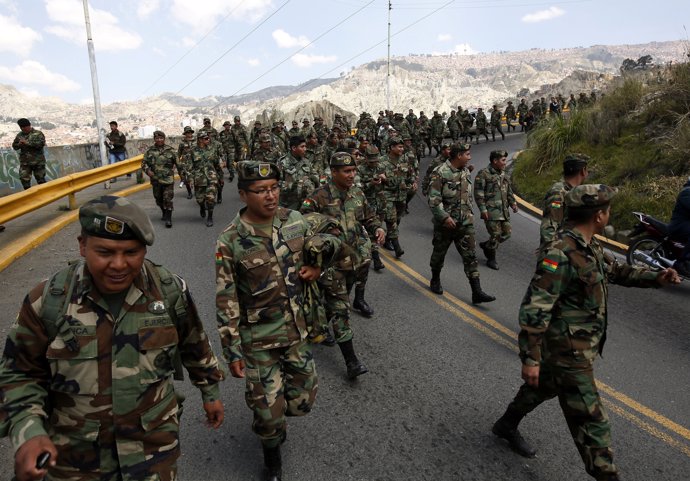 Bolivia's low ranking army officers march towards the Navy forces headquarters i