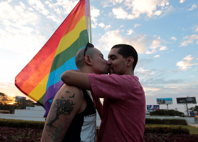 Participants kiss during a gay pride parade in Managua, Nicaragua June 28, 2016.