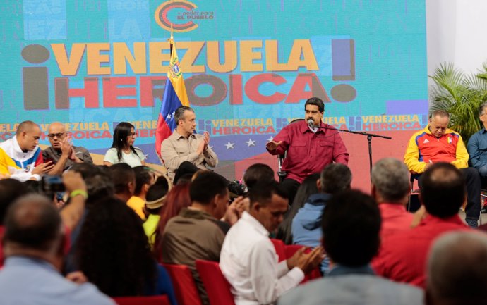 Venezuela's President Nicolas Maduro (2nd R) speaks during a meeting with member