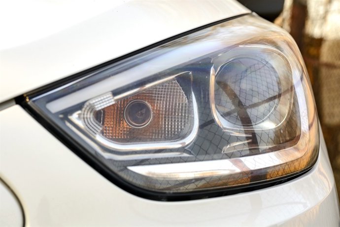 White Car Headlights. Exterior Detail Automobile Close-Up