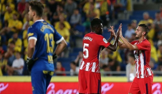 Koke celebra un gol con Thomas con el Atlético de Madrid