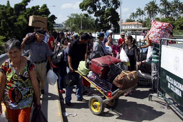 People cross the Colombian-Venezuelan border over the Simon Bolivar internationa