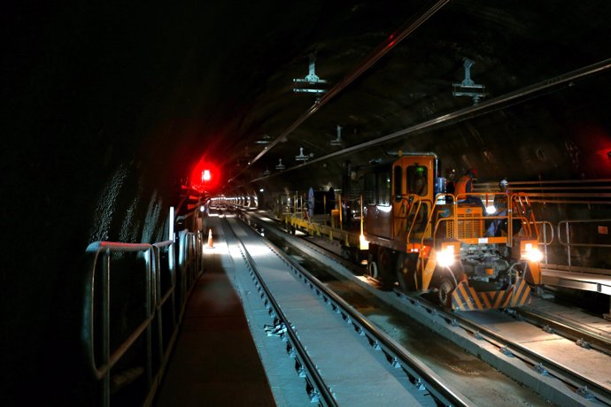 A train travels along a tunnel at a subway station under construction, during a 