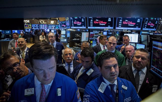Traders work on the floor of the New York Stock Exchange July 17, 2014. U.S. Sto